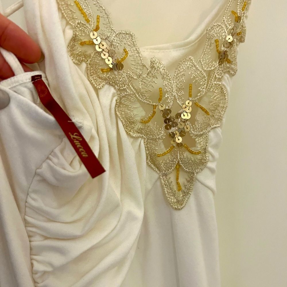 White dress with gold embellishments in medium