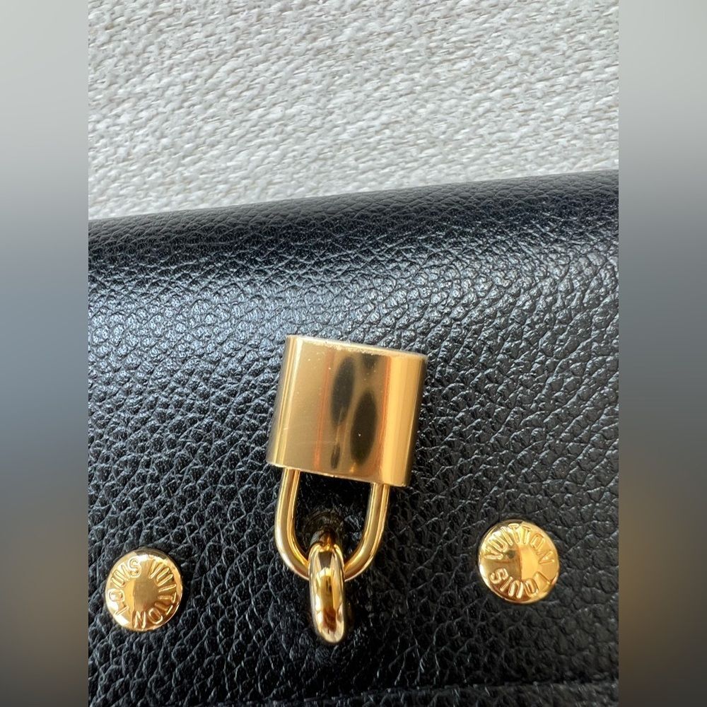 876. Louis Vuitton Black and Brown Monogram Wallet