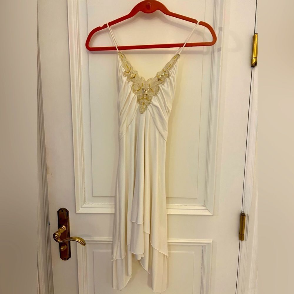 White dress with gold embellishments in medium