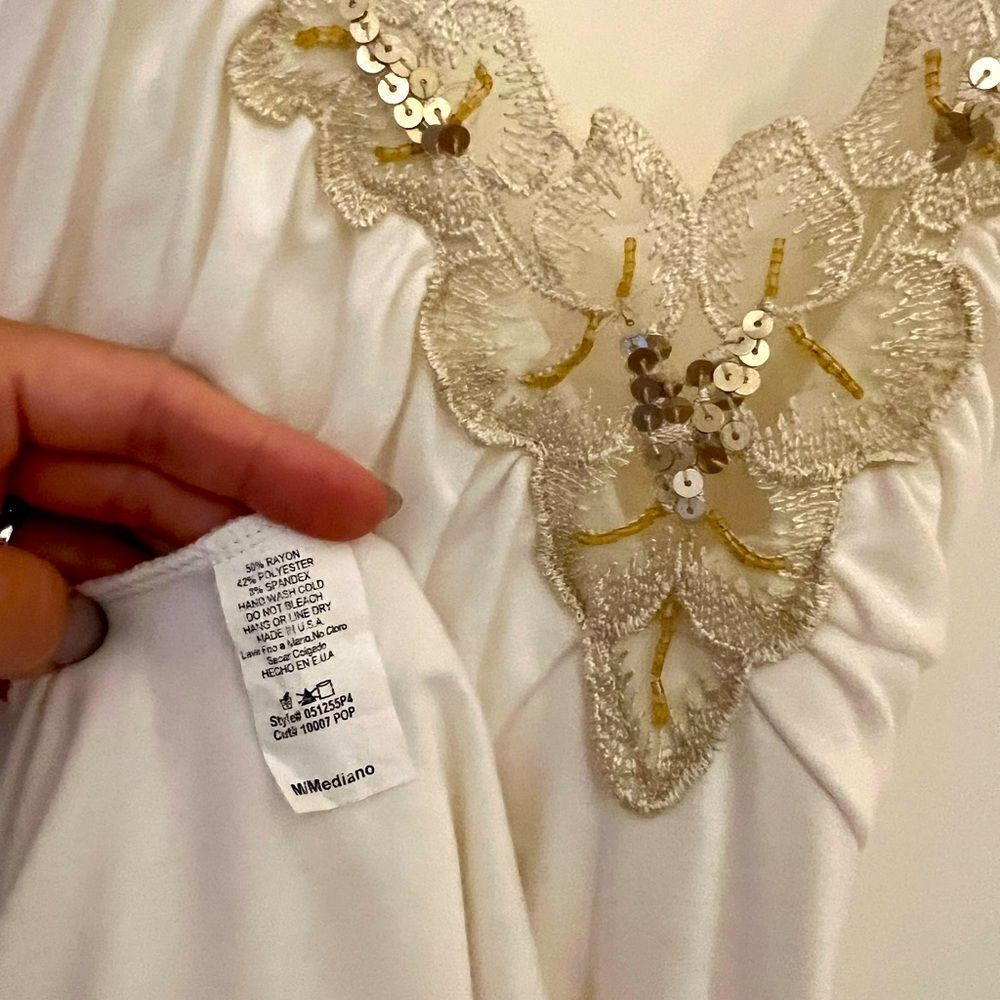 White dress with gold embellishments in medium