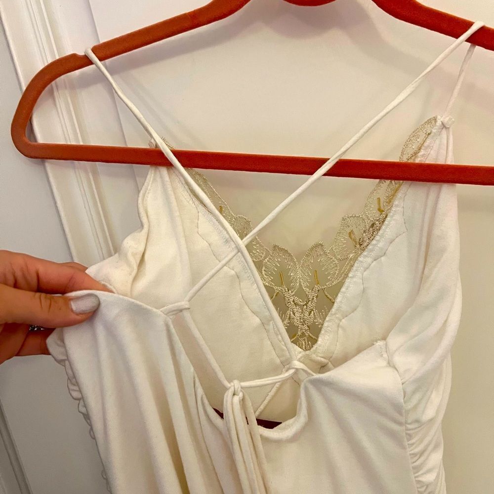 White dress with gold embellishments in medium