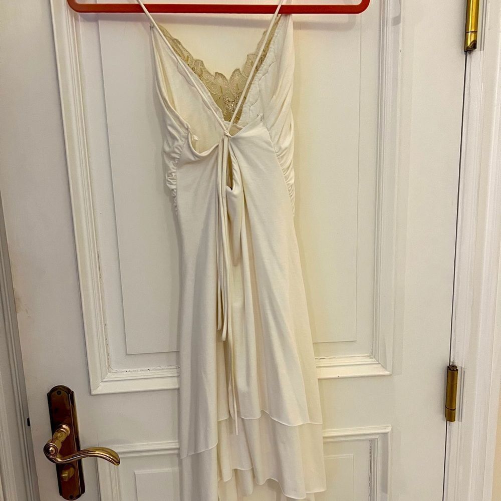 White dress with gold embellishments in medium